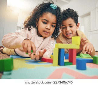 Building blocks, happy children and floor with toys for playing, bonding and educational games at home. Family, child development and boy and girl enjoy creative activity, learning and relaxing - Powered by Shutterstock