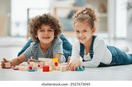 Building blocks, smile and portrait of children on living room floor for leaning, creative and geometric solution. Playroom, education and Montessori puzzle with kids in family home for youth toys - Powered by Shutterstock