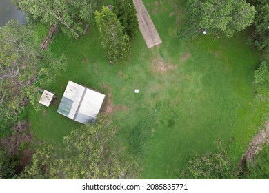 Building And Boat Ramp At Middle Creek Dam, Queensland, Australia Top Down View Has Drone Comes In To Land