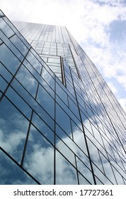 Building with cloud reflections