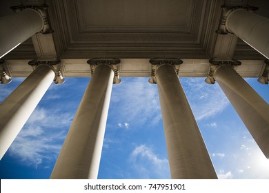 Building column on a government building with a beautiful blue sky.