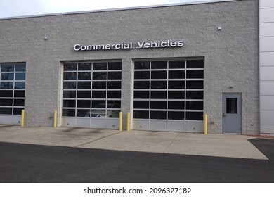 Building With A Commercial Vehicle Repair Shop With Four Garage Doors