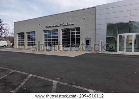 Building with a commercial vehicle repair shop with four garage doors