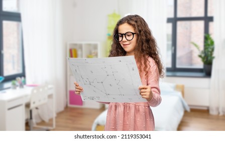 building, construction and profession concept - smiling little girl in glasses with blueprint over children's room background