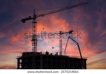 Building construction. Construction site on sunset. Tower crane on Housing, renovation. Crane on formwork. Pouring concrete, сoncrete pump truck. Residential buildings Construction on sunset.  