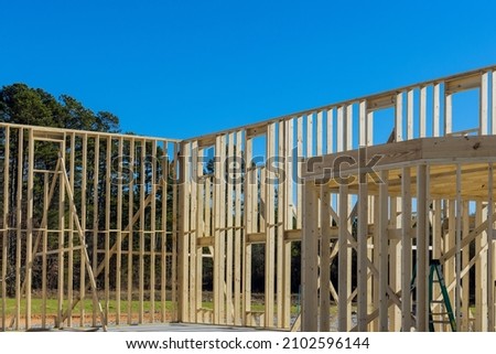 Building construction wood framing beams of a new house under construction