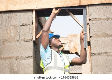 A Building Contractor Using A Square