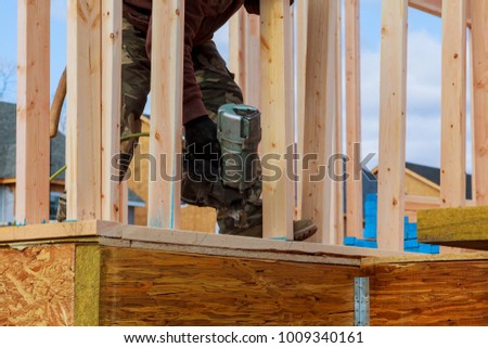 Building contractor worker putting in a interior wall partition