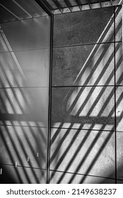 Building Corner With Sunlight And Shadows In Black And White.