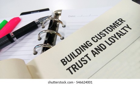 Building Customer Trust And Loyalty Printed On White Book