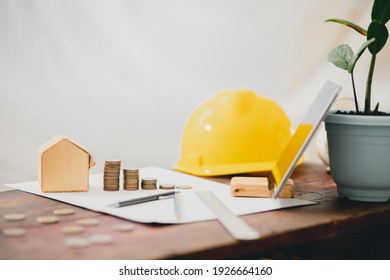 Building design concept Architectural workbench with structural drawing device The concept of uncle real estate capital, saving money to expand business capital - Powered by Shutterstock