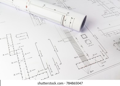 Building Design: Office Desk With Project Drawings