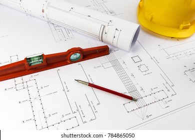 Building Design: Office Desk With Project Drawings