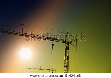 Similar – The sun sets and the cranes rise