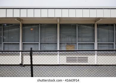 Building elevation - generic building with large windows and closed metal blinds
