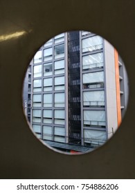building in the evening taking through the circle round hole 
