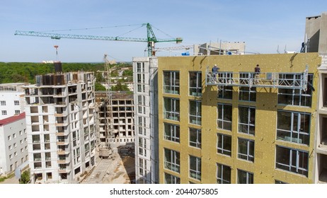 Building External Wall Thermal Insulation With Mineral Wool. Exterior Passive House Wall Heat Insulation With Mineral Wool. Insulation The Facade Of Commercial Building. Energy Efficiency