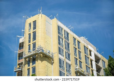 Building External Wall Thermal Insulation With Mineral Wool. Exterior Passive House Wall Heat Insulation With Mineral Wool. Insulation The Facade Of Commercial Building. Energy Efficiency