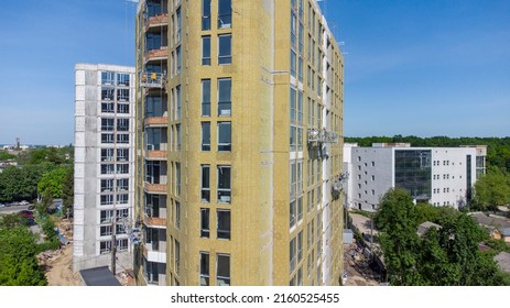 Building External Wall Thermal Insulation With Mineral Wool. Exterior Passive House Wall Heat Insulation With Mineral Wool. Insulation The Facade Of Commercial Building. Energy Efficiency