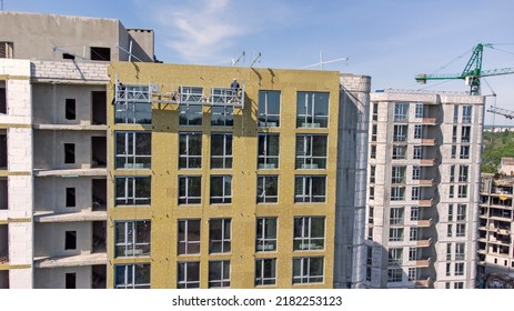 Building External Wall Thermal Insulation With Mineral Wool. Exterior Passive House Wall Heat Insulation With Mineral Wool. Insulation The Facade Of Commercial Building. Energy Efficiency