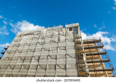 Building Facade Covered For Restoration Work