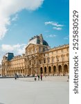 Building Facade of the Louvre Museum in Paris France with Neoclassic Renaissance Architecture on a Sunny Summer Day