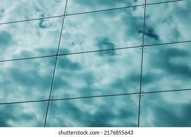 Building Facade With Reflections And Colours. Glass Architecture With Sky