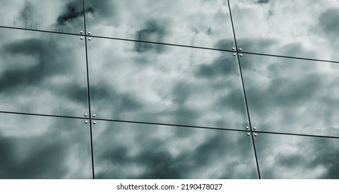 Building Facade With Reflections And Colours. Glass Architecture With Sky