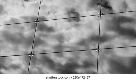 Building Facade With Reflections And Colours. Glass Architecture With Sky