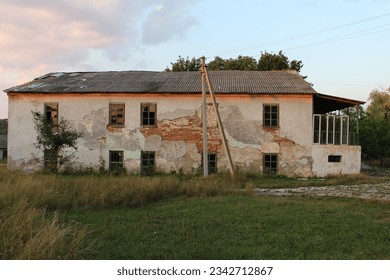 A building with a fence and grass - Powered by Shutterstock