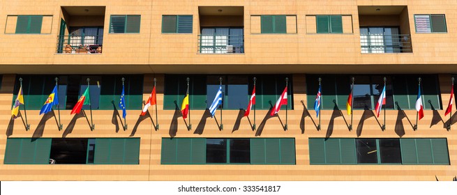 Building with flags of different countries close up