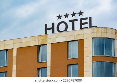Building of generic 4-star hotel with a badge on a roof