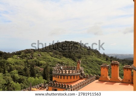 A building with a hill in the background