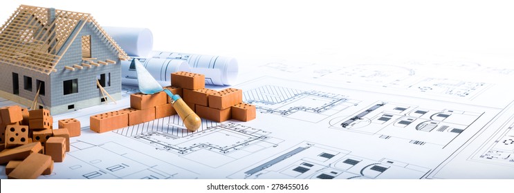 building house - brick and project for construction industry background
