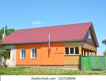 Building House With Metal Roof, Steel Gas Chimney, Wooden Veranda, Plastering And Painting Walls.