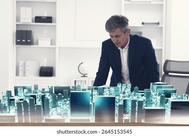 Building information modelling. Man using holographic projection of city in office - Powered by Shutterstock - Get 15% off with code: PIKWIZARD15