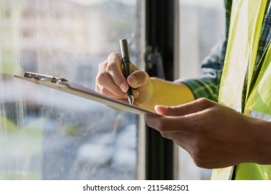 Building inspection, asian contractor young man, male inspecting home, reconstructed construction, renovation or check defect, before finish handing it over to client, customer. Engineering worker. - Shutterstock ID 2115482501