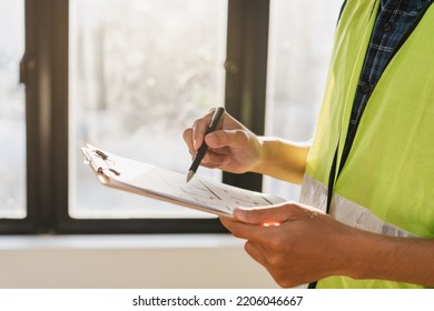 Building inspection, asian contractor young man, male inspecting home, reconstructed construction, renovation or check defect, before finish handing it over to client, customer. Engineering worker. - Shutterstock ID 2206046667