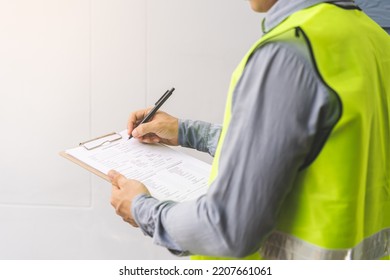 Building inspection, contractor asian young man, male inspecting home, reconstructed construction, renovation or check defect, before finish handing it over to client. Engineering worker, copy space. - Shutterstock ID 2207661061