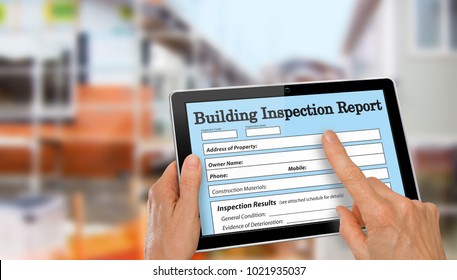 Building Inspector Completing An Inspection Form On Computer Tablet