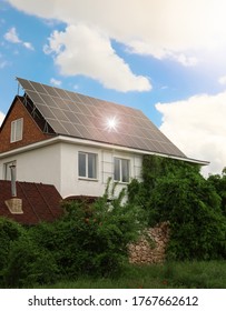 Building with installed solar panels on roof. Alternative energy source - Shutterstock ID 1767662612