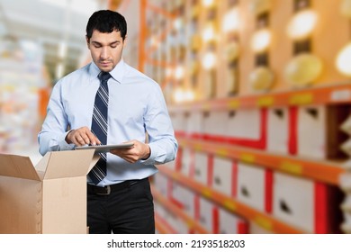 Building Inventory Management Concept. Man Using Digital Tablet, Showing Warehouse Software Management Dashboard On Warehouse