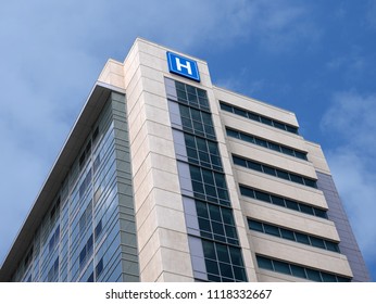 Building With Large H Sign For Hospital