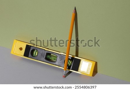Building level with pencil. Creative layout