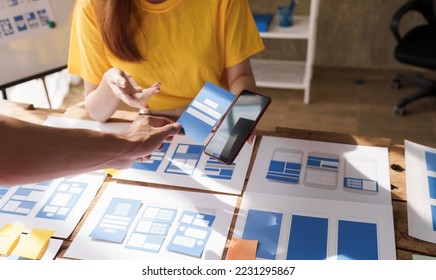 Building and managing a UX team working at desk, UX designers participate in all phases of the UX design. - Shutterstock ID 2231295867