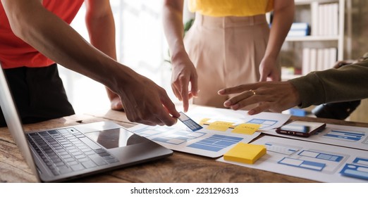 Building and managing a UX team working at desk, UX designers participate in all phases of the UX design. - Shutterstock ID 2231296313