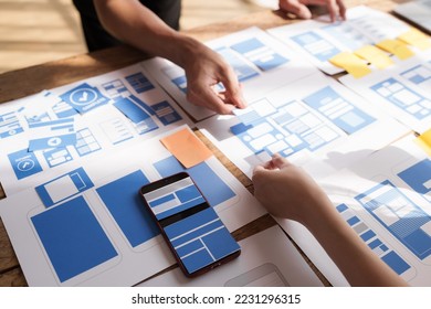 Building and managing a UX team working at desk, UX designers participate in all phases of the UX design. - Shutterstock ID 2231296315