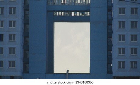 building with many windows and arch constructivism