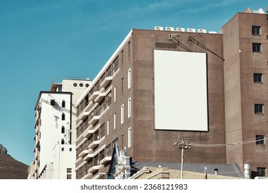 Building, mockup space and advertising banner, commercial product or logo design in city. Empty poster for brand marketing, multimedia and communication with announcement, urban and billboard outdoor