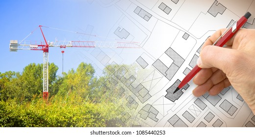 Building A New City - Concept Image With And Drawing An Imaginary Cadastral Map Of Territory With Buildings, Fields And Roads And A Tower Crane In A Construction Site